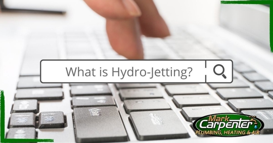 person typing on keyboard