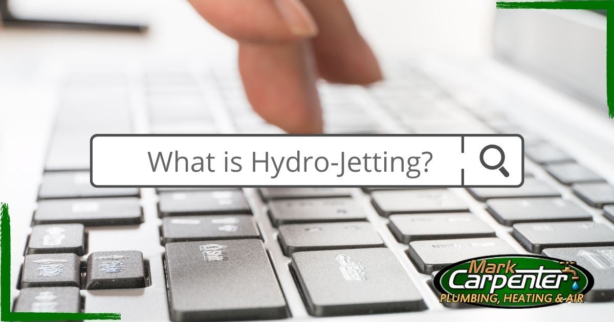 person typing on keyboard