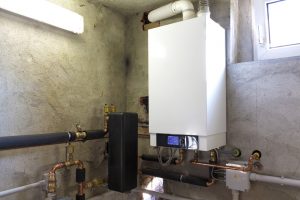 Boiler mounted on wall basement