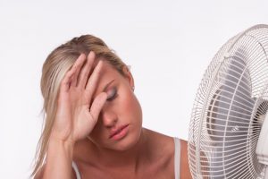 Woman in front of a fan